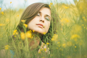 Sticker - beautiful romantic girl on blooming rapeseed field enjoying nature, young elegant woman walking,pretty female face, concept happiness , freedom, inspiration