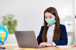© deagreez - Photo of little student school girl student using notebook table online lesson video call sit desk social distancing wear uniform protection mask quarantine study living room classroom indoors