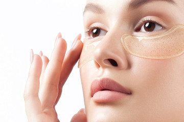 Poster - Young beautiful woman with clean perfect skin with cosmetic patches on face close-up