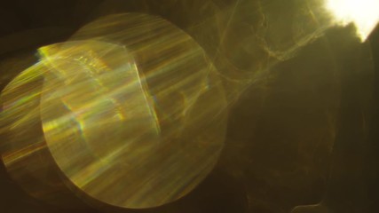 Wall Mural - lens flares and warm bokeh on dark background. art vintage effect