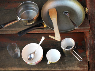 old kitchenware placed in a cupboard