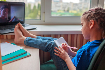 Wall Mural - English class with student tutor online. Girl studying English language with student at home