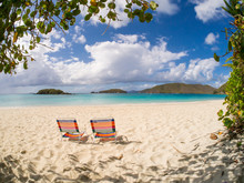 Two Beach Empty Chairs On Cinnamon Bay Beach On The Caribbean Island Of St John In The US Virgin Islands