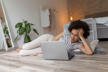 Sticker - Woman surfing the Internet on laptop computer