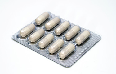 Herbal drug panels pack in capsules on a white background.