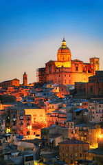 Canvas Print - Late evening with Piazza Armerina church and old town reflex