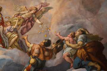  Painting of angel dropping coins to followers on the domed ceiling of Charles Church in Vienna, Austria.