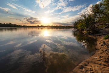 Wall Mural - Beautiful evening on the river at sunset