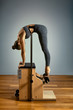 © Georgii - combo wunda pilates chair woman instructor fitness yoga gym exercise. Copy space. sports banner