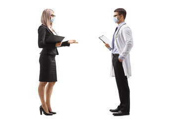 Poster - Businesswoman and a male doctor talking and wearing protective masks