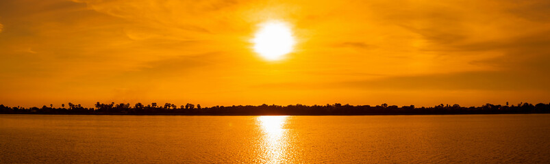 Wall Mural - Panorama orange sky background at sunset.