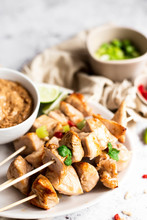 Chicken Skewers With Satay Sauce And Spring Onion And Chilli Pepper Sides