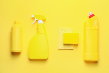 Set of cleaning supplies on color background