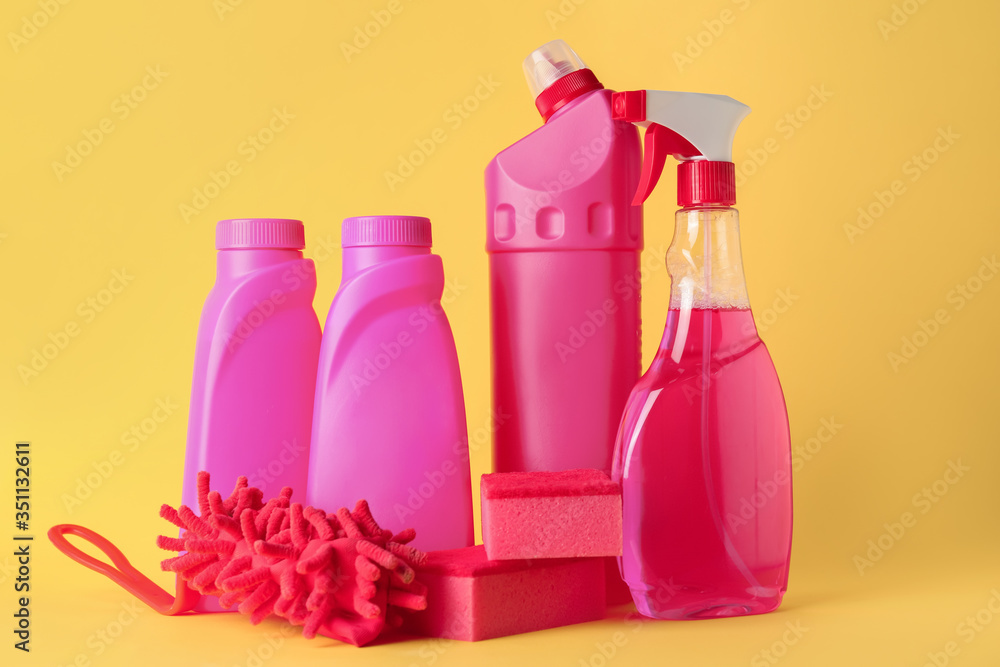 Set of cleaning supplies on color background