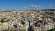 Aerial view of Birgu, Senglea and Bormla - ancient towns near Valletta. Old architecture, medieval houses historic centre. Malta from drone. Blue sky with clouds. Summer.

