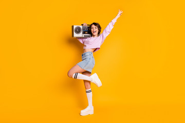 Poster - Full length body size view of her she nice attractive lovely cheerful funny girl carrying boombox having fun dancing retro vintage trend isolated on bright vivid shine vibrant yellow color background