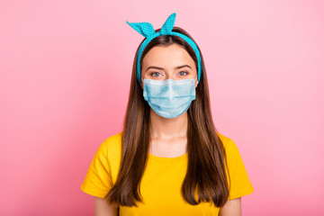 Poster - Portrait of charming youngster lady stay home covid-19 quarantine wearing breathing mask yellow t-shirt isolated over pink background