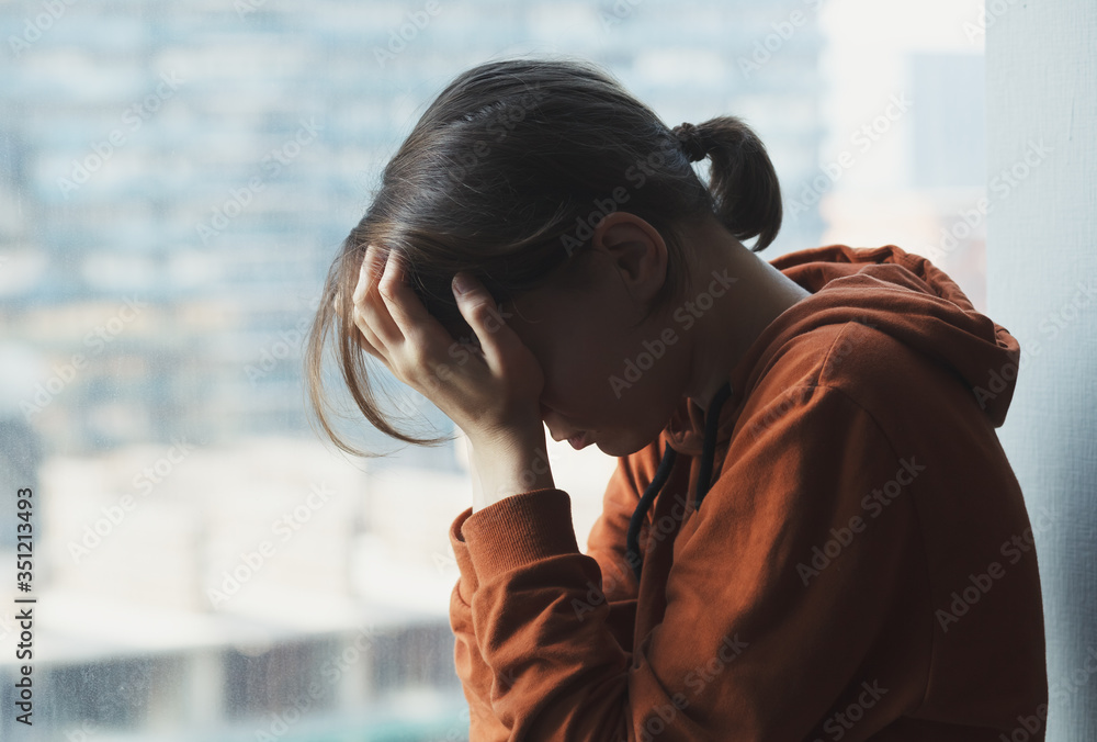 mental health, stress, migraine or depression concept, young sad depressed frustrated woman sitting at home alone suffering and crying - obrazy, fototapety, plakaty 