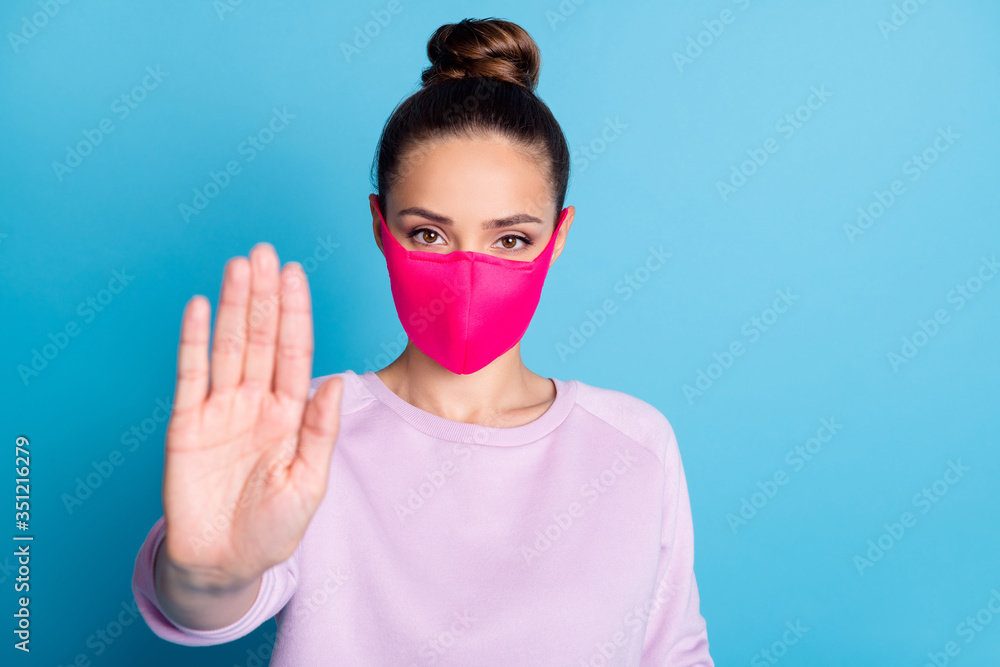 Stay away. Closeup photo of pretty lady keep social distance raise palm arm don't let people contacting her wear protect bright face mask sweater isolated blue color background - obrazy, fototapety, plakaty 
