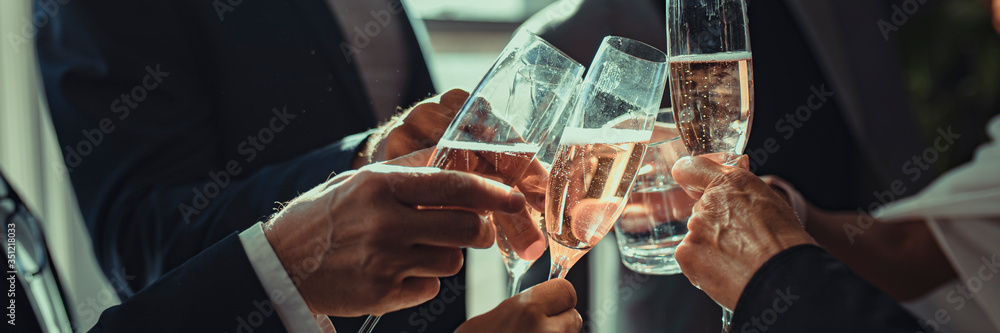 Business people making a toast at an office party - obrazy, fototapety, plakaty 