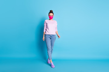 Sticker - Full length photo of pretty lady keep social distance walk outside breathe fresh air alone going supermarket wear protect face mask jeans pullover shoes isolated blue color background