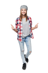 Wall Mural - Smiling teen girl in full length giving double thumb up