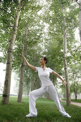 Woman practising tai chi in the park