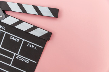 Filmmaker profession. Classic director empty film making clapperboard or movie slate isolated on pink background. Video production film cinema industry concept. Flat lay top view copy space mock up.