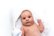 © stanciuc - Adorable 2 months old little baby boy on towel after bath over white background