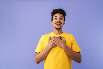 Wall Mural - Photo of excited african american man smiling with hands on chest