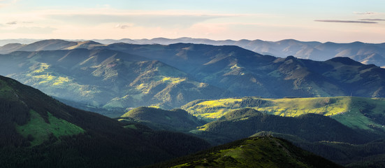 Wall Mural - Panoramic view. Mountain landscape with beautiful blue sky. Majestic spring scenery. Touristic place. Amazing summertime wallpaper background. Concept of nature rebirth. Save Earth.