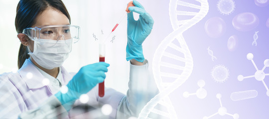 scientist in goggles, surgical mask and gloves dropping  liquid into the blood test tube with a pipette in the scientific laboratory.