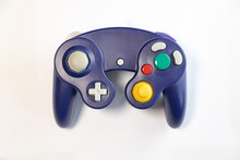 Purple Controller For Video Games Console On White Background