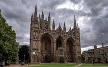 The Frontage Of Peterborough Cathedral With Dramatic Sky In The Background