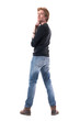 © sharplaninac - Rear view of cocky young handsome red hair man turning and looking at camera with head back. Full body length isolated on white background.