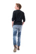 © sharplaninac - Behind of young confident handsome red hair man walking away and looking at side with hands in pockets. Full body length isolated on white background.