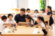 © Blue Jean Images - Children learning coding in classroom
