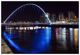 Gateshead Millennium Bridge Over Tyne River At Night