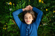 © Westend61 - Portrait of girl with eyes closed relaxing on a meadow in spring