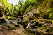 © robertharding - Women posing for a beautiful picture at the Beji Guwang Hidden Canyon, Bali, Indonesia, Southeast Asia, Asia