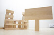 © Caner - Building with wooden parts. Close-up on white background. Studio