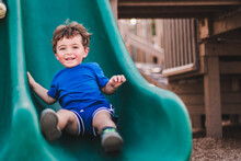 Boy On Playground Slide In Marco Island Mackle Park 