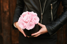 Young Girl Holding Tender Pink Roses In Black Gift Box