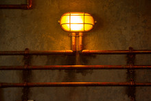 Yellow Bulkhead Light. Ship Deck Lamp. Industrial Background
