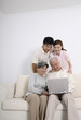 © ImageHit - Senior man using laptop while senior woman, woman and man watches him