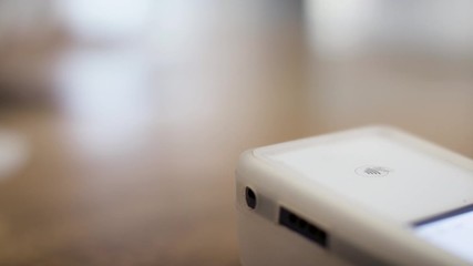 Tap payment with a card at small business. Pos system payment with tap. Credit payment at small business. Shot in 4k.