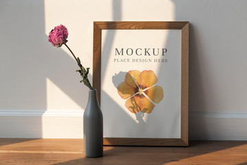 Wall Mural - dried pink peony flower in a gray vase by a wooden frame mockup on the floor