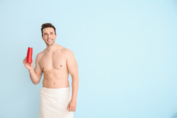 Poster - Handsome man with shower gel on color background