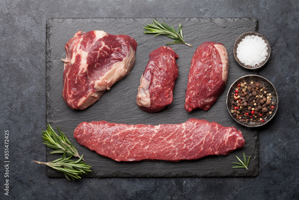 Variety of fresh raw beef steaks - obrazy, fototapety, plakaty 