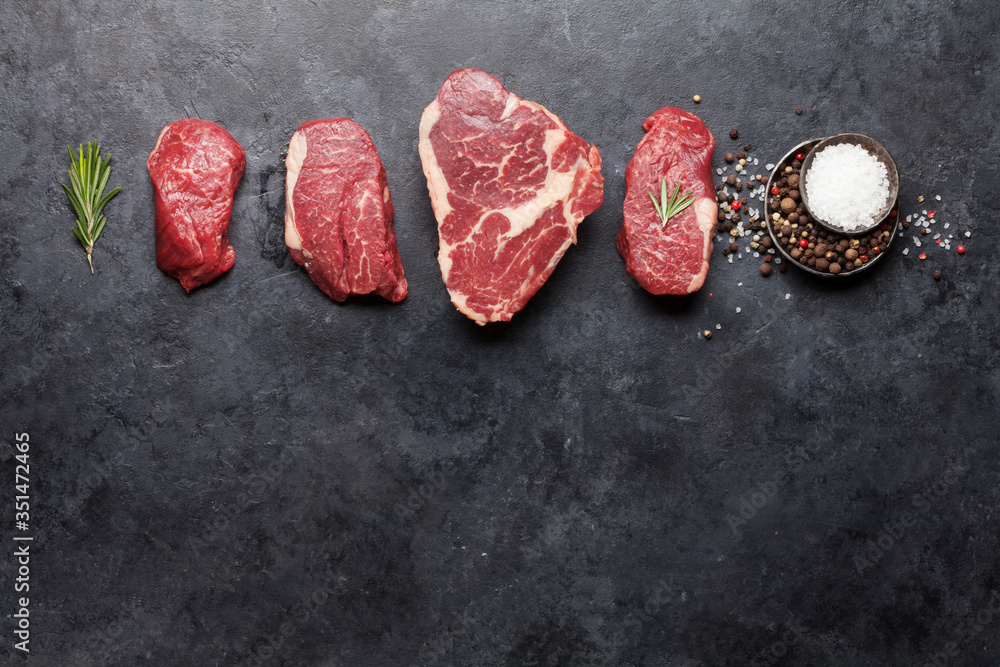 Variety of fresh raw beef steaks - obrazy, fototapety, plakaty 